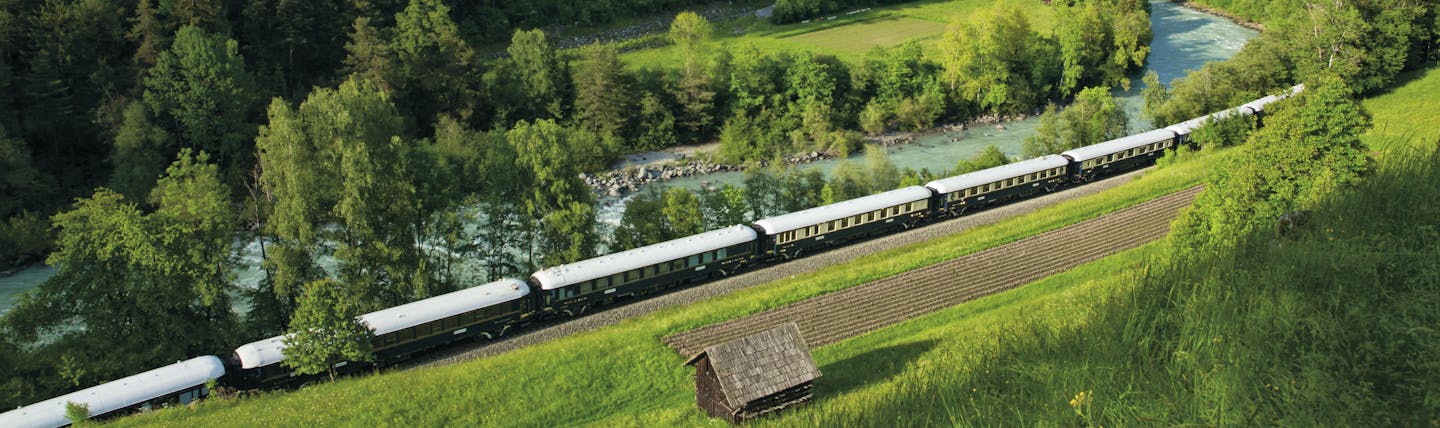 Orient Express train in Austrian mountain landscape