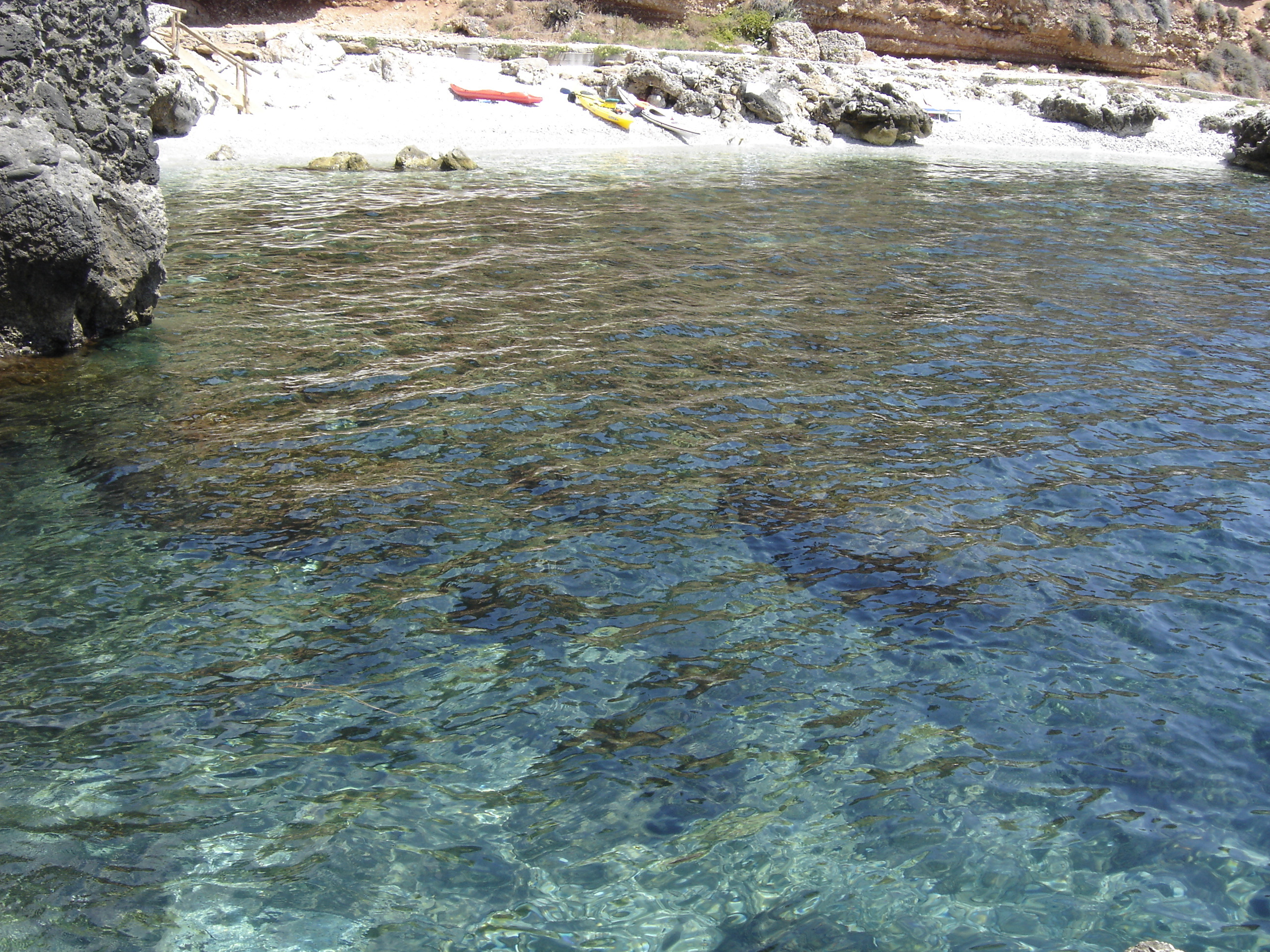 Sandy beach and clear blue water