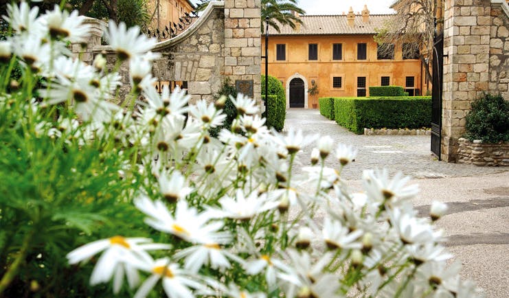 La Posta Vecchia Latium gateway leading to hotel flowers