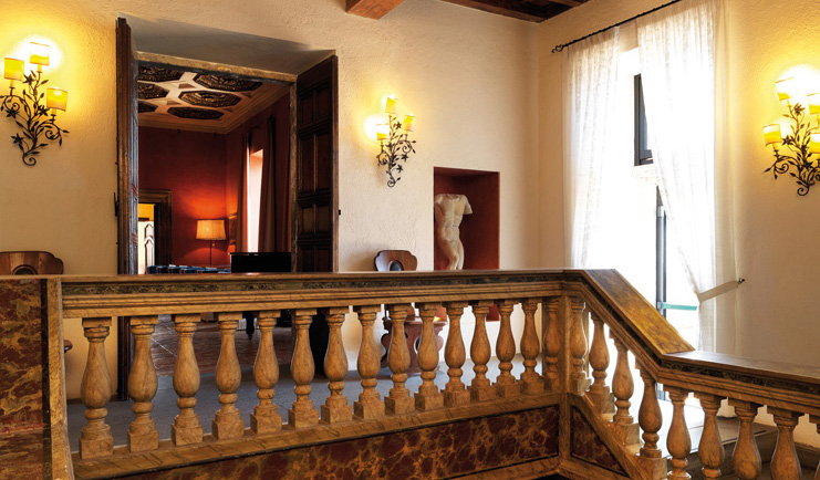 La Posta Vecchia Latium hall way antiques ornate décor