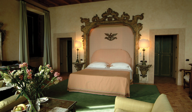 La Posta Vecchia Latium senior suite bedroom bed armchairs ornate décor
