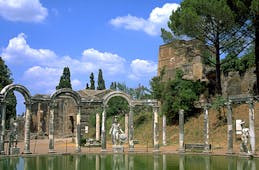 Roman columns and stone arches around pool at Hadrian's Villa in Tivoli near Rome