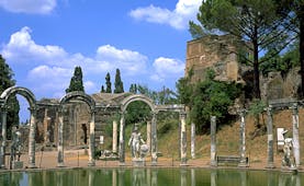Roman columns and stone arches around pool at Hadrian's Villa in Tivoli near Rome