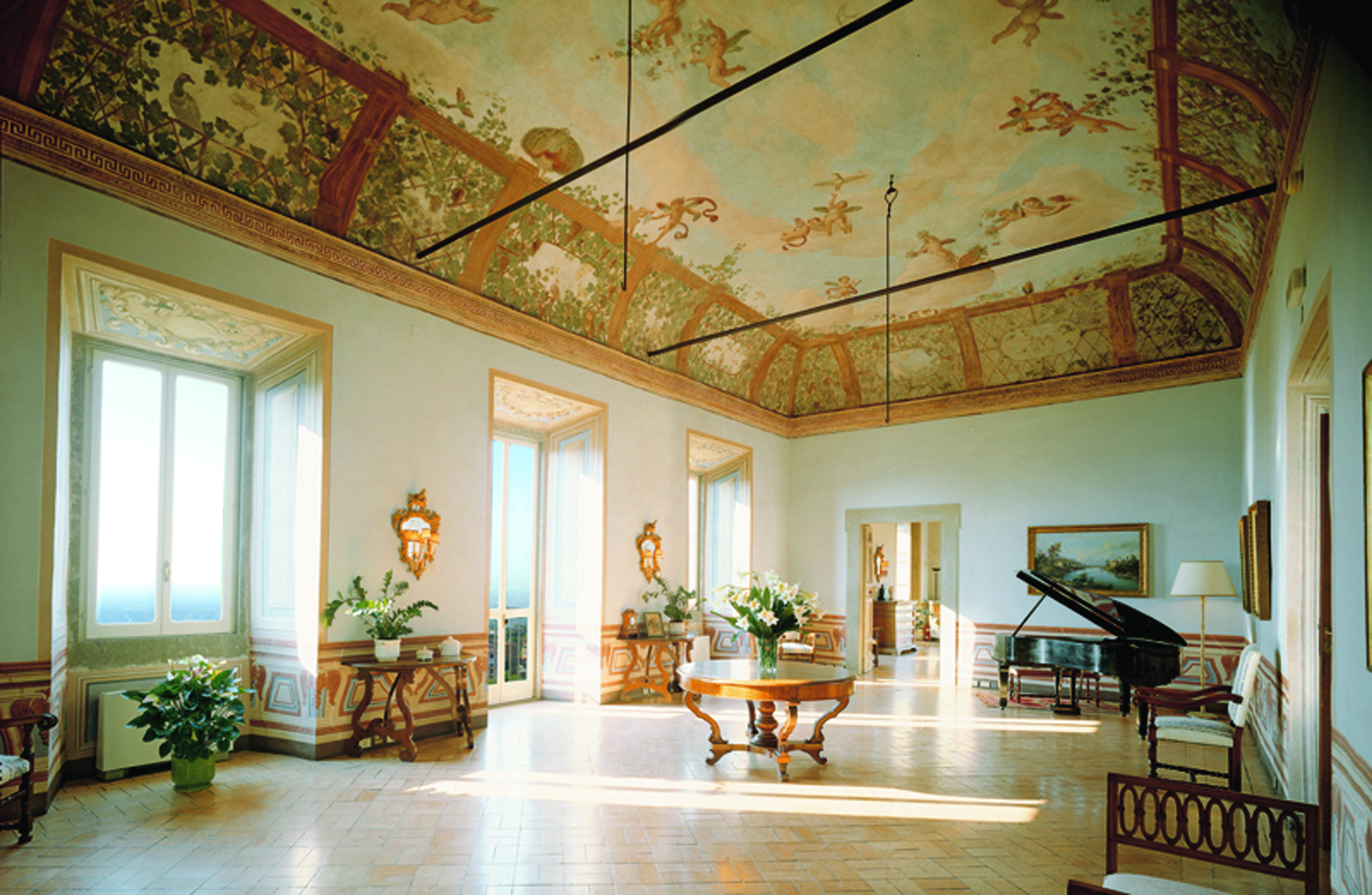 Vila Grazioli Latium Sala Dei Putti grand piano large windows frescoed ceiling ornate décor