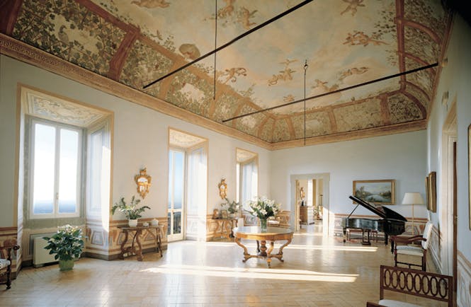 Vila Grazioli Latium Sala Dei Putti grand piano large windows frescoed ceiling ornate décor