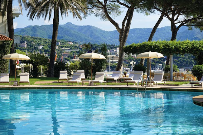 Grand Hotel Miramare Ligurian Riviera pool sun loungers umbrellas mountains in the distance 