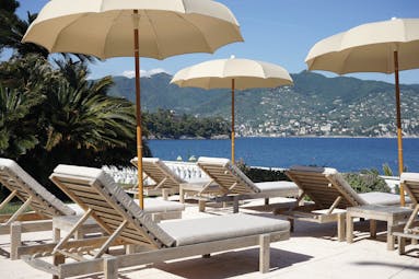Grand Hotel Miramare Ligurian Riviera view from pool sun loungers umbrellas overlooking the sea