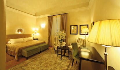 Relais Sant'Uffizio Piemonte Paul III suite bed seating area elegant décor