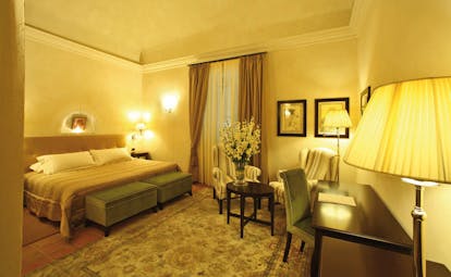 Relais Sant'Uffizio Piemonte Paul III suite bed seating area elegant décor