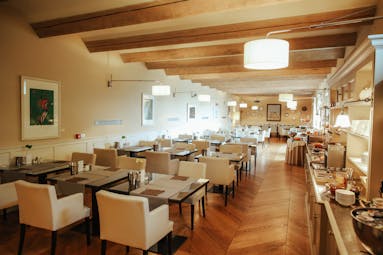 Villa D'Amelia Piemonte cream walls and wooden floors of breakfast room