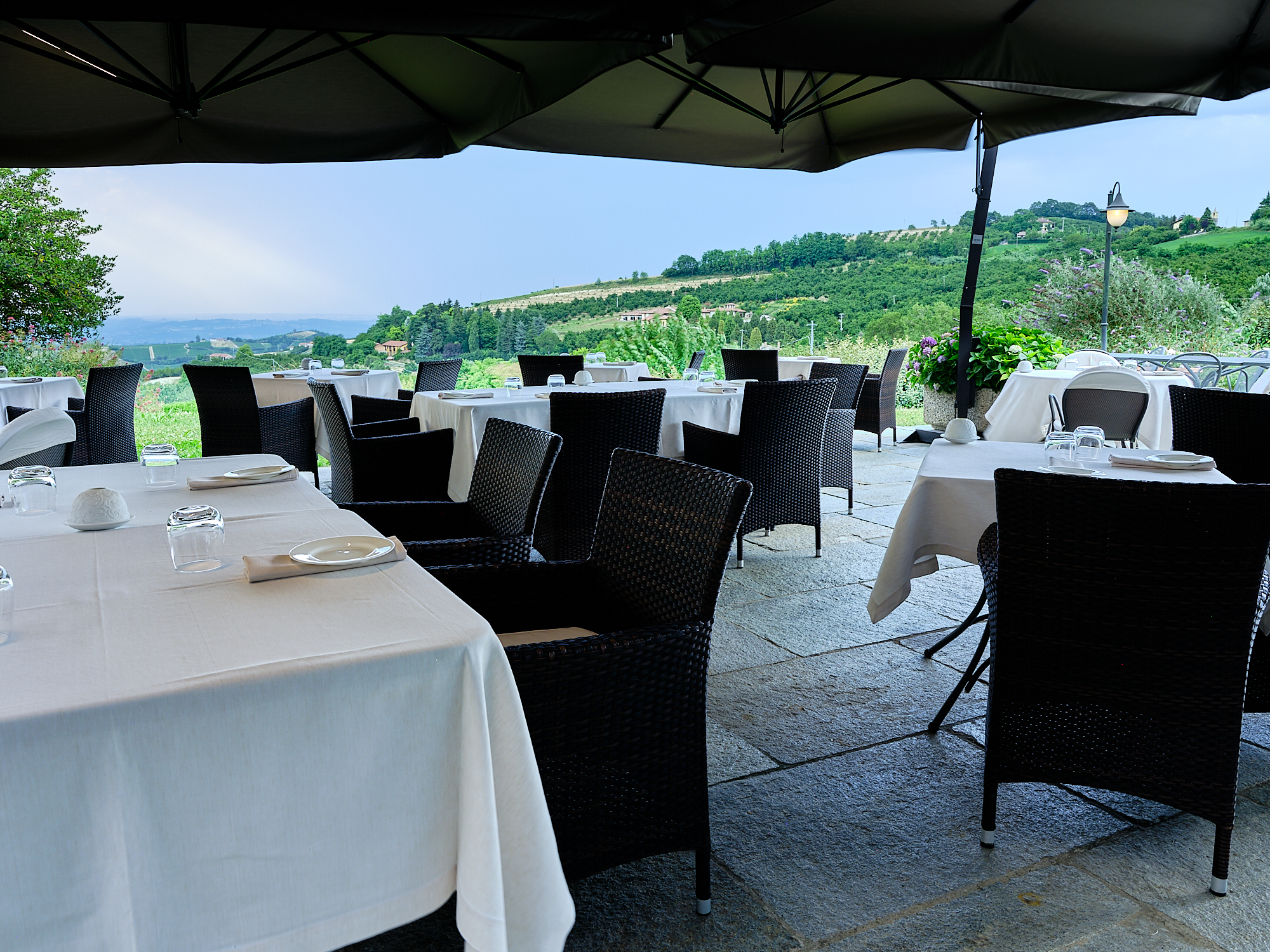 Villa D'Amelia Piemonte terrace with views and outdoor dining with white table cloths