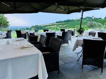 Villa D'Amelia Piemonte terrace with views and outdoor dining with white table cloths