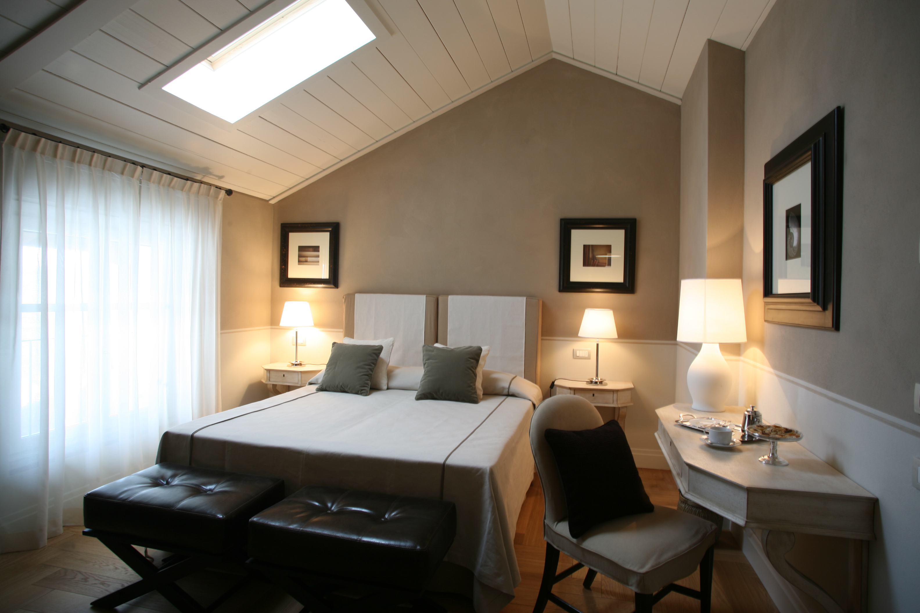 Villa D'Amelia Piemonte cream and brown coloured room with sloping ceiling