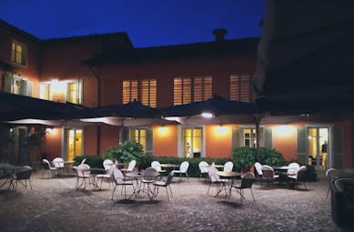 Villa D'Amelia Piemonte courtyard with lights at night