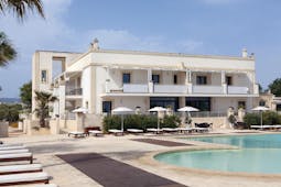 Canne Bianche Puglia exterior rear pool sun loungers umbrellas pool terrace