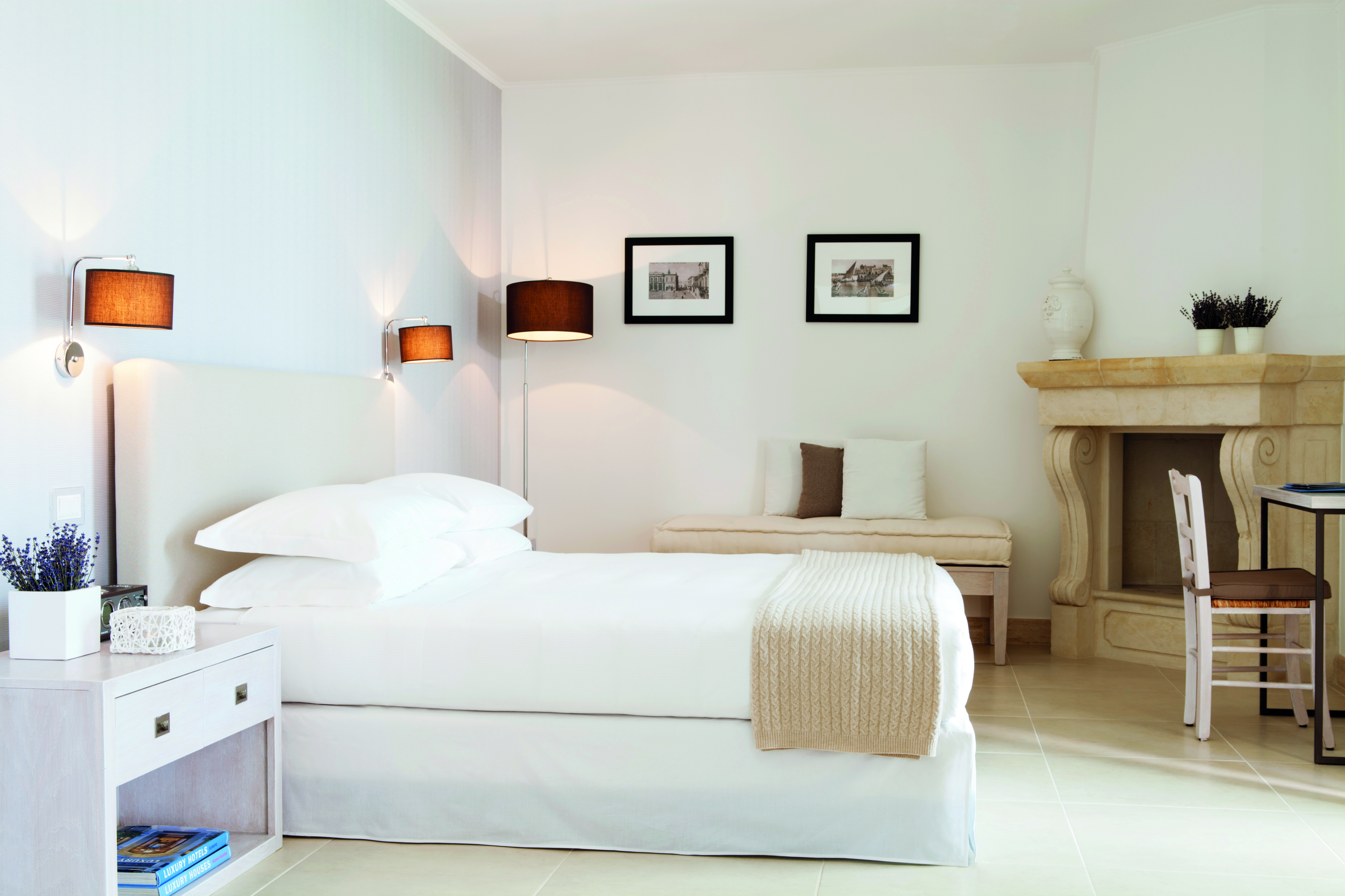 Canne Bianche Puglia junior suite bedroom modern décor bed stone corner fireplace
