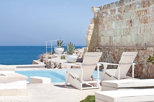 Don Ferrante Puglia jacuzzi pool sun loungers overlooking the sea
