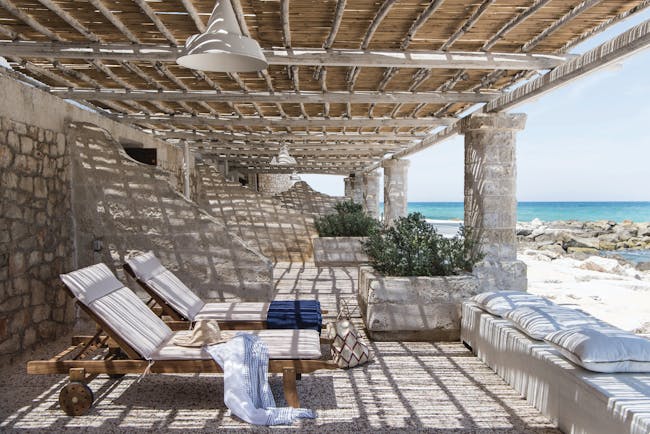 La Peschiera Puglia patio on the beach shaded area with sun loungers