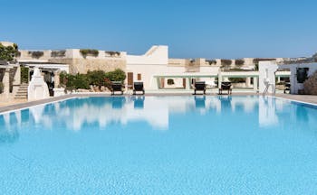 La Peschiera Puglia pool sun loungers clear blue skies