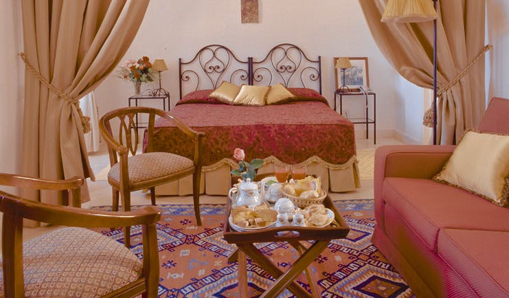 Masseria San Domenico Puglia deluxe room bed chairs sofa traditional décor