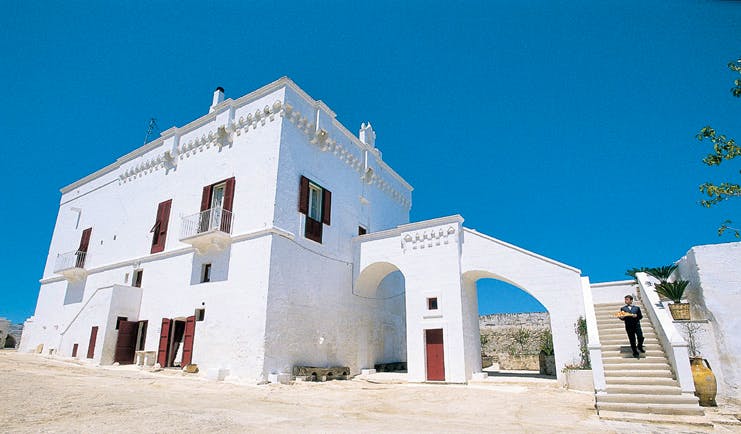 Masseria Torre Coccaro Puglia exterior hotel building white stone traditional architecture