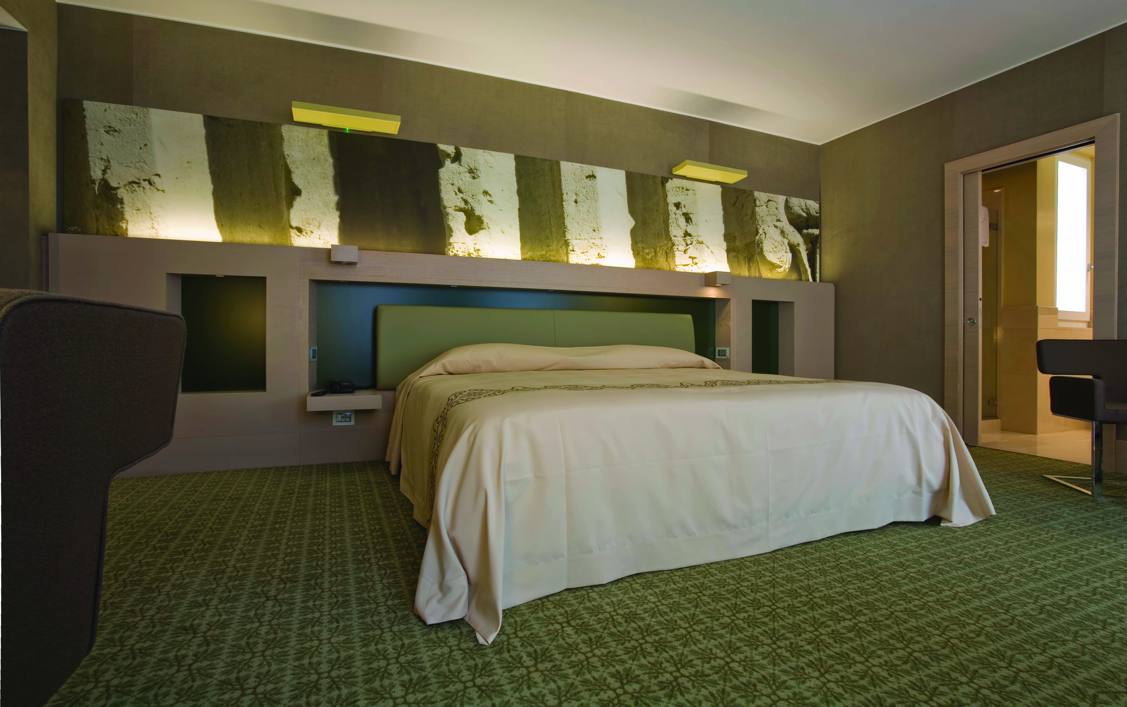 Risorgimento Resort Puglia executive bedroom bed en suite bathroom modern décor