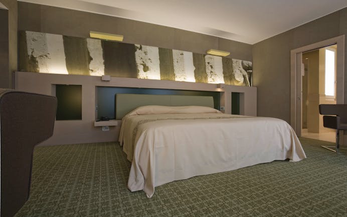 Risorgimento Resort Puglia executive bedroom bed en suite bathroom modern décor