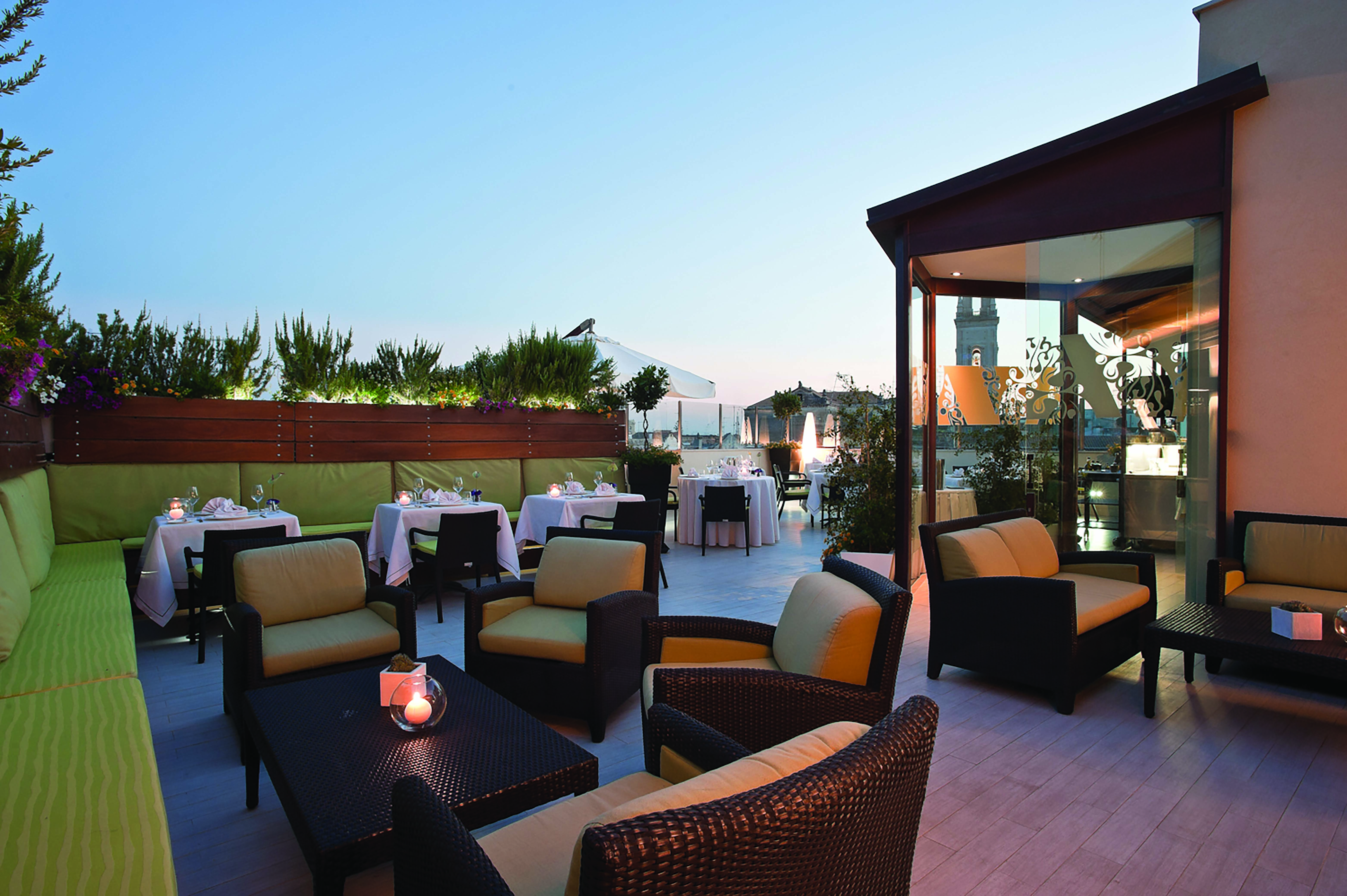 Risorgimento Resort Puglia outdoor dining rooftop restaurant at dusk