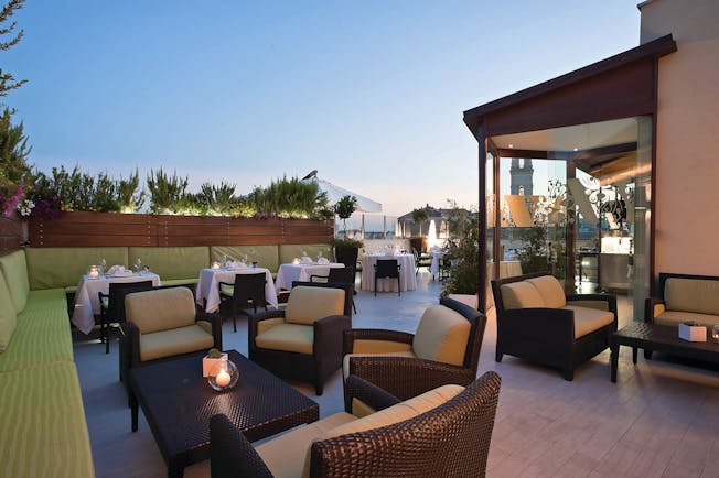 Risorgimento Resort Puglia outdoor dining rooftop restaurant at dusk