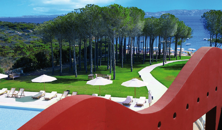 Hotel La Coluccia Sardinia balcony view over pool lawns sea in background