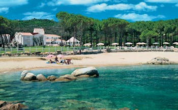 Hotel La Coluccia Sardinia beach sandy beach sea hotel buildings in background