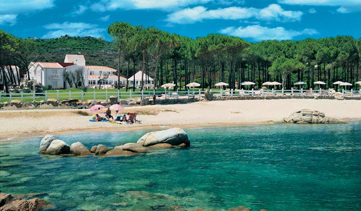 Hotel La Coluccia Sardinia beach sandy beach sea hotel buildings in background