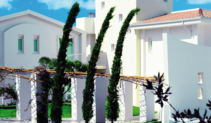 Hotel La Coluccia Sardinia gardens trees lawn hotel building modern architecture