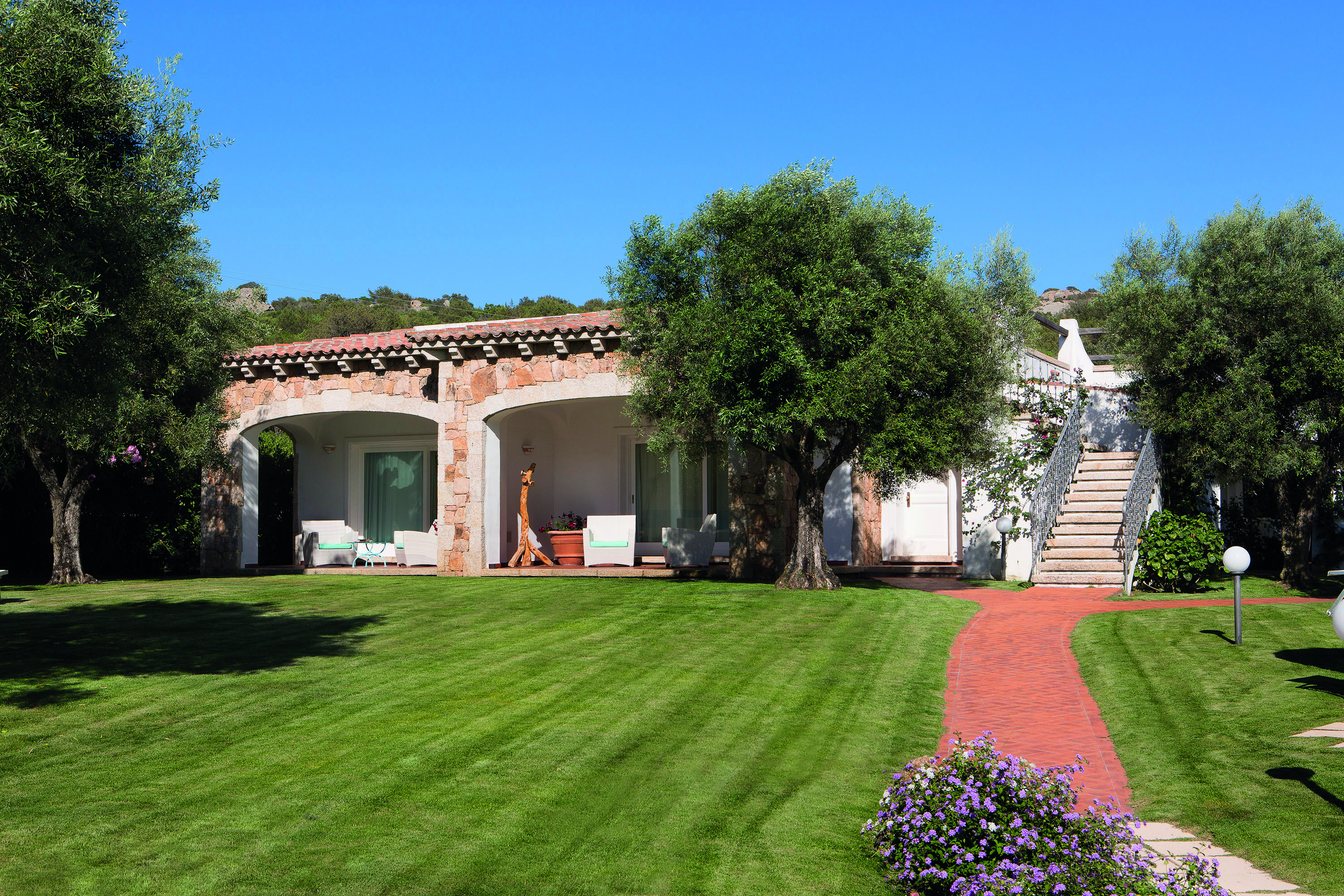 La Rocca Sardinia exterior view suites lawns trees patios