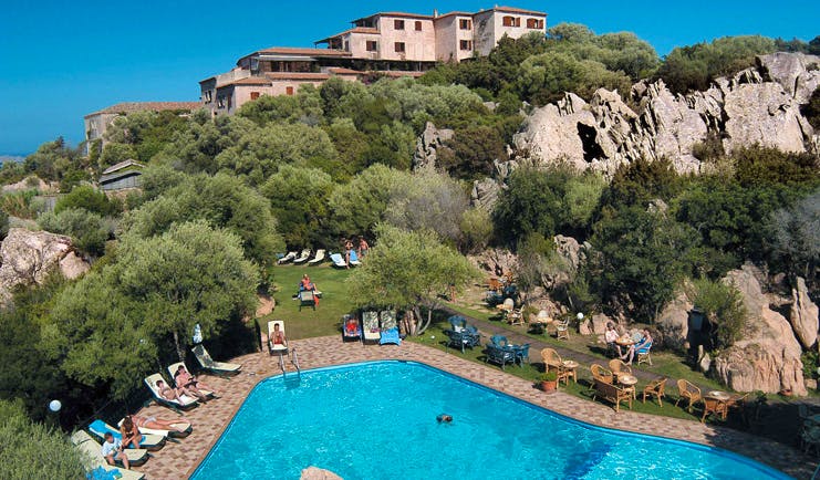 Hotel Rocce Sarde Sardinia pool sun loungers gardens hotel building in background