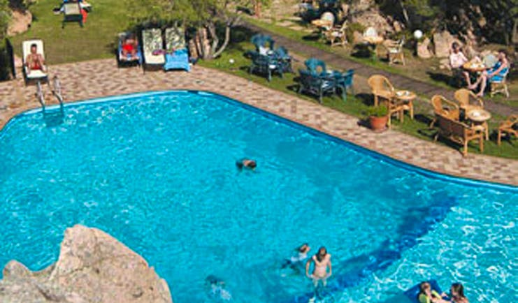 Hotel Rocce Sarde Sardinia poolside sun loungers lawns 