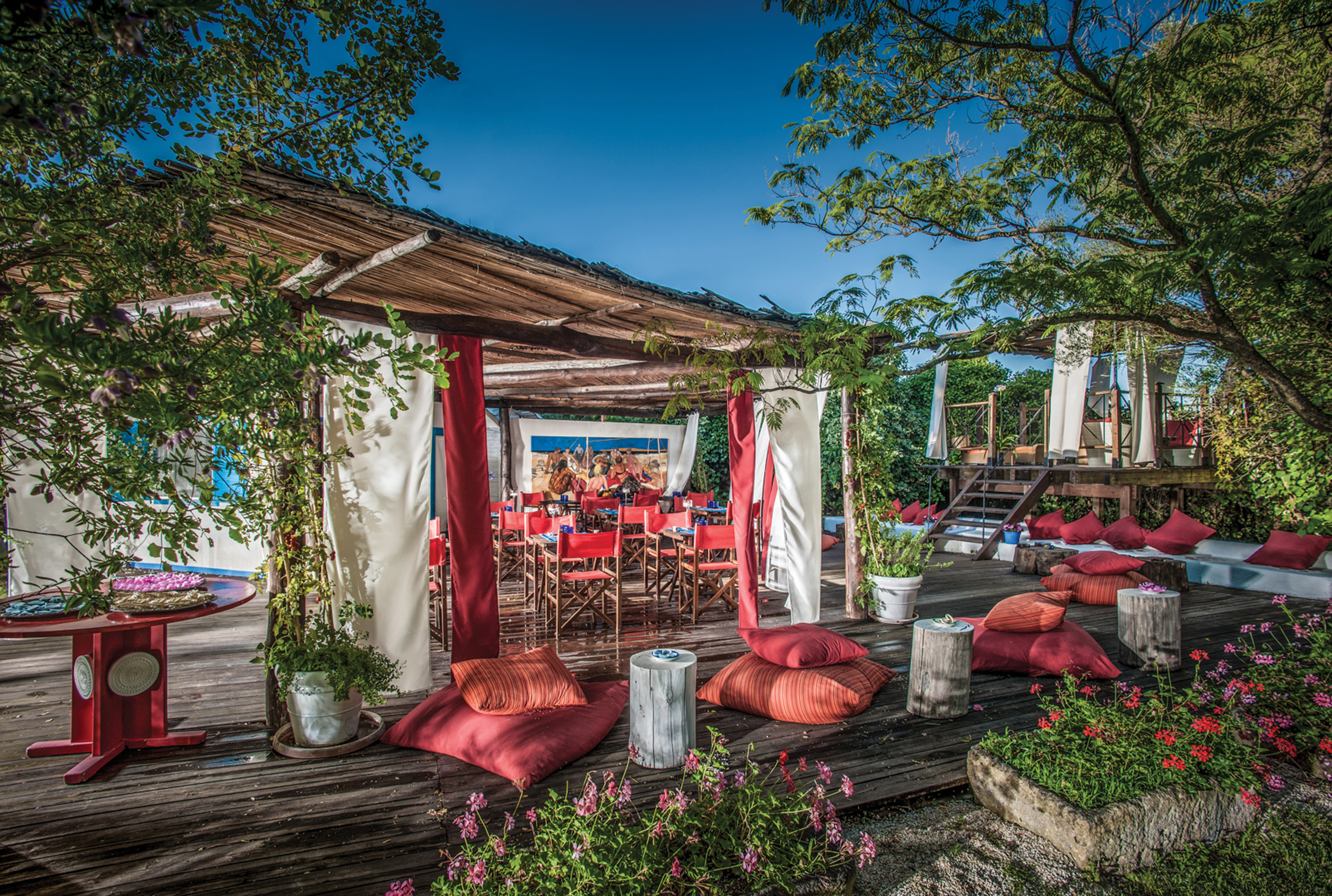 Outdoor dining area terrace with red and white colour scheme