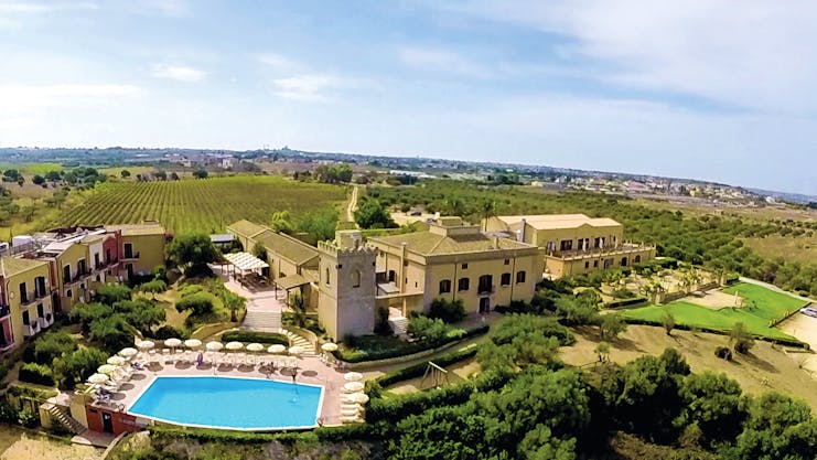 Baglio Oneto aerial shot of hotel showing hotel buildings, pool and surrounding Sicilian countrysode