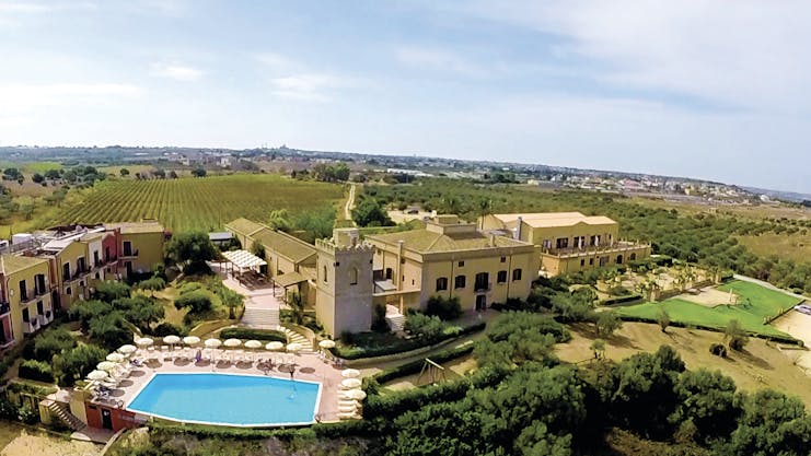 Baglio Oneto aerial shot of hotel showing hotel buildings, pool and surrounding Sicilian countrysode