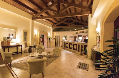 Baglio Oneto bar, tiled floor, chairs, vaulted ceiling, elegant decor
