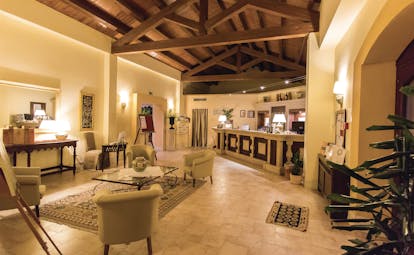 Baglio Oneto bar, tiled floor, chairs, vaulted ceiling, elegant decor