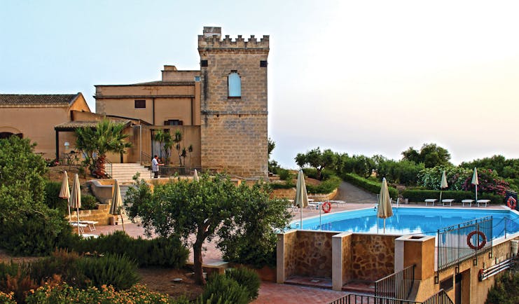 Baglio Oneto exterior, hotel buildings and pool, traditional Sicilian architecture