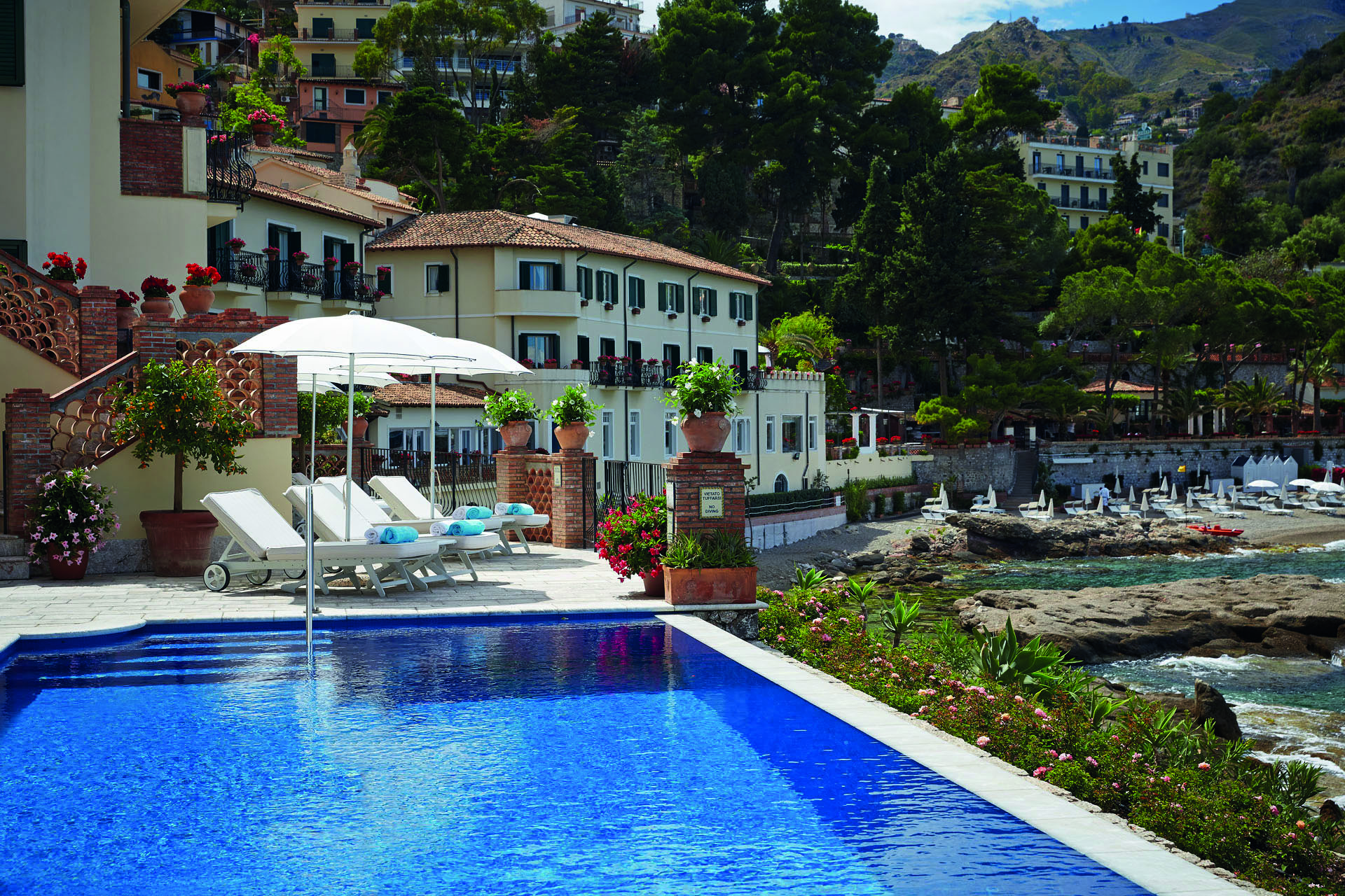 Villa Sant Andrea Sicily exterior pool hotel building pool sun lounger