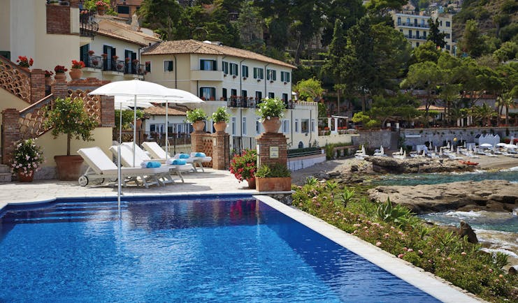Villa Sant Andrea Sicily exterior pool hotel building pool sun lounger