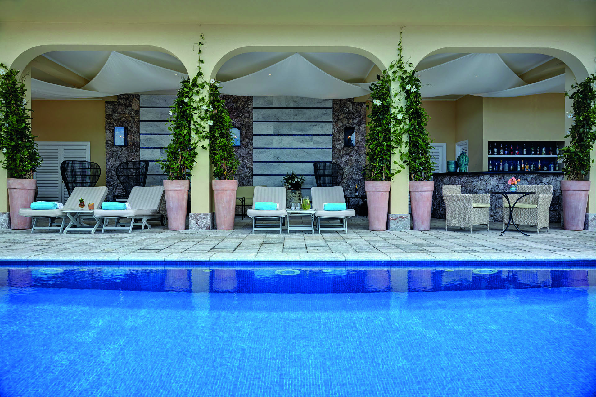 Villa Sant Andrea Sicily pool sun loungers on decking