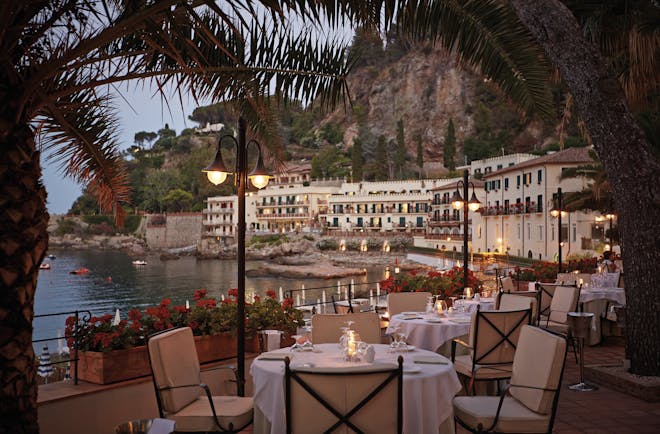 Villa Sant Andrea Sicily terrace outdoor dining terrace overlooking the sea candle light