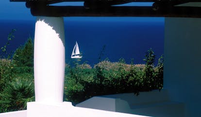 Capofaro Hotel Sicily boat on water 