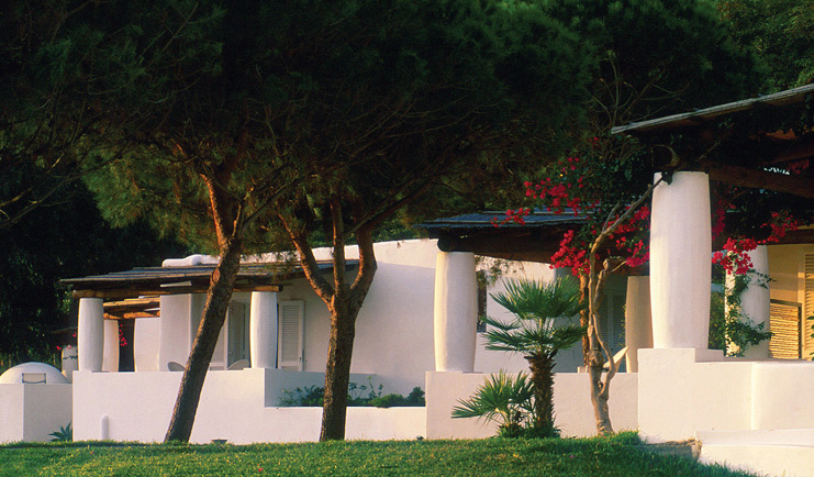 Capofaro Hotel Sicily hotel building white wash walls flat roofs lawn trees