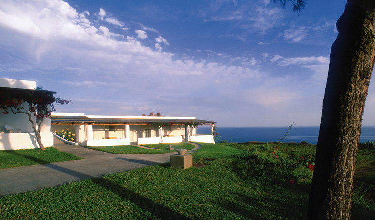 Capofaro Hotel Sicily entrance path hotel buildings sea in background