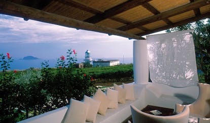 Capofaro Hotel Sicily private terrace covered outdoor seating area sea views island in distance
